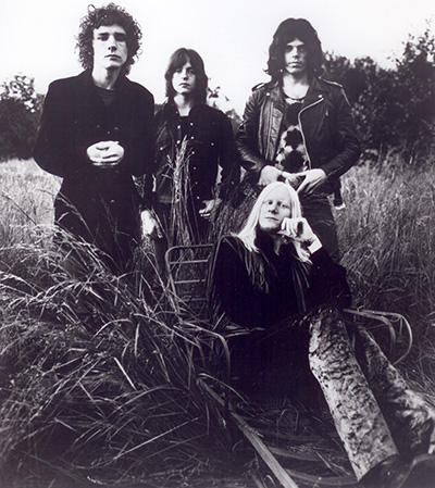 Photo of Johnny Winter And band with Randy Jo Hobbs, standing behind Johnny Winter